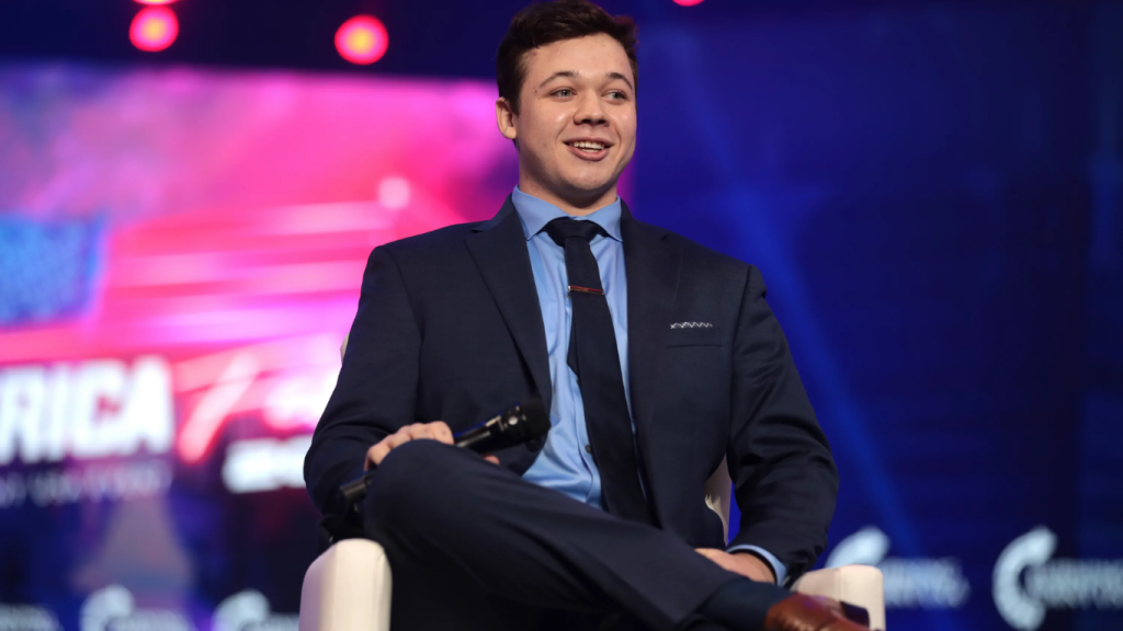 Kyle Rittenhouse sitting for a professional interview, representing his public appearances and financial discussions.