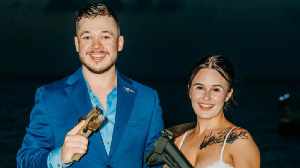 Kyle Rittenhouse standing alongside his wife, posing together for a photo at a formal event.