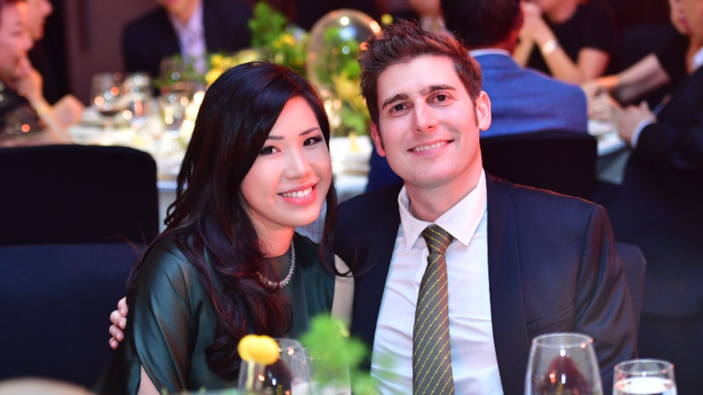 A formal photograph of Eduardo Saverin wife, Elaine Andriejanssen, smiling together at an evening event.