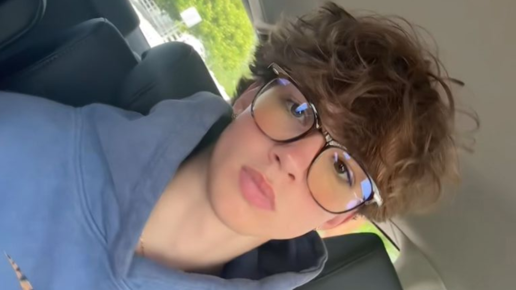 Jackson Brooks posing outdoors in casual style for digital media article.