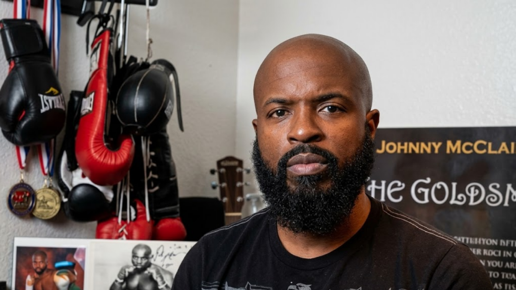 Johnny McClain (Yahya), former boxer and producer with Filmworks Production background
