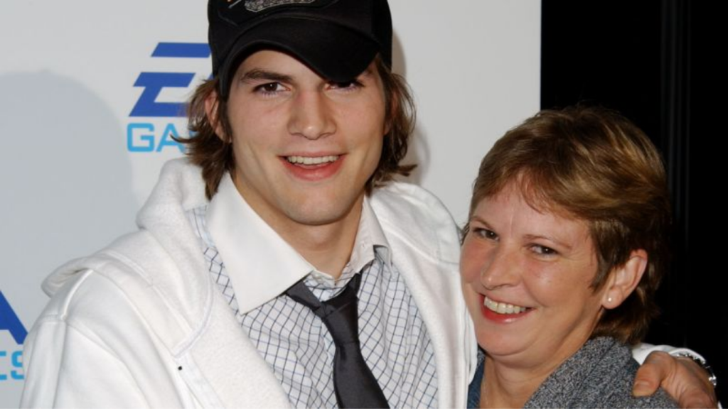Ashton Kutcher standing with his mother Diane Finnegan Kutcher at a private family event in Iowa.