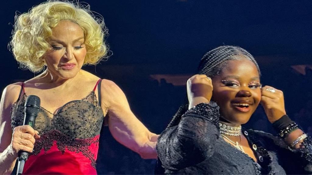 Mercy James playing the piano live on stage during Madonna’s Celebration Tour.